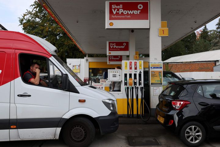 Motorists queue for petrol and diesel fuel at a Shell petrol station in Fleet