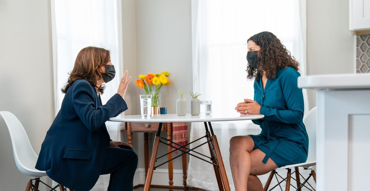 The author with Vice President Kamala Harris at the kitchen table.