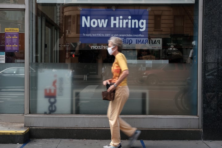 A hiring sign is displayed in a store window in Manhattan on Aug. 19 in New York City.