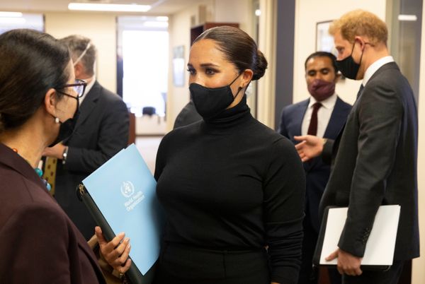 Harry and Meghan talk to leaders after their joint round table with the WHO.