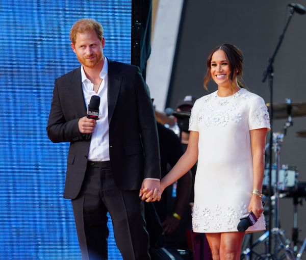 Harry and Meghan smiled at the 60,000 people who were there.