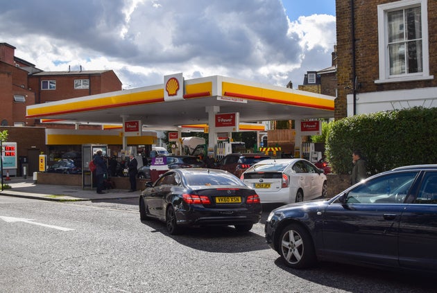 Cars queuing outside a Shell station in
