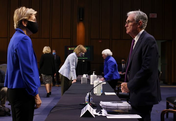 Sen. Elizabeth Warren (D-Mass.) talks to Federal Reserve Chairman Jerome Powell on Tuesday. Shortly after, Warren announced she would oppose Powell's renomination to lead the nation’s central bank.
