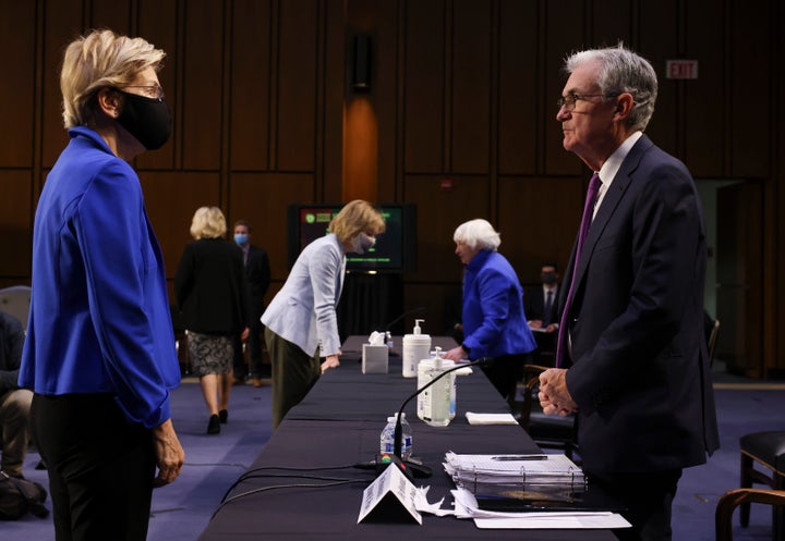 Sen. Elizabeth Warren (D-Mass.) talks to Federal Reserve Chairman Jerome Powell on Tuesday. Shortly after, Warren announced she would oppose Powell's renomination to lead the nation’s central bank.