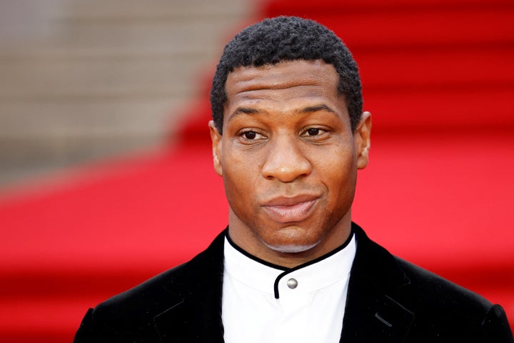 Jonathan Majors walks the carpet.