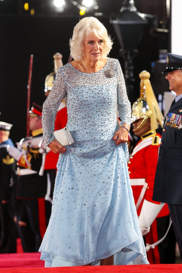 The Duchess of Cornwall paired her embellished gown with a white clutch. 