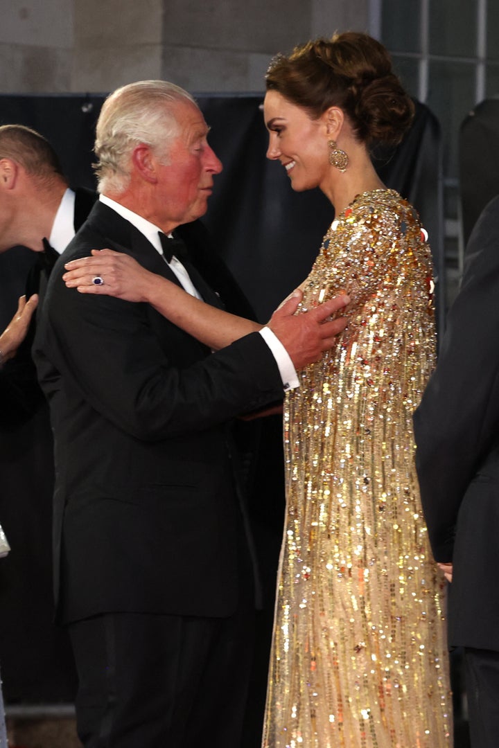 Charles and Kate greet each other on the red carpet. 