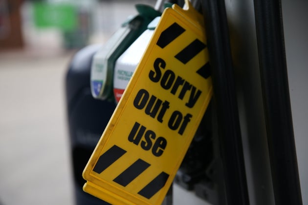 Out of use sign is attached to pumps at a petrol station in