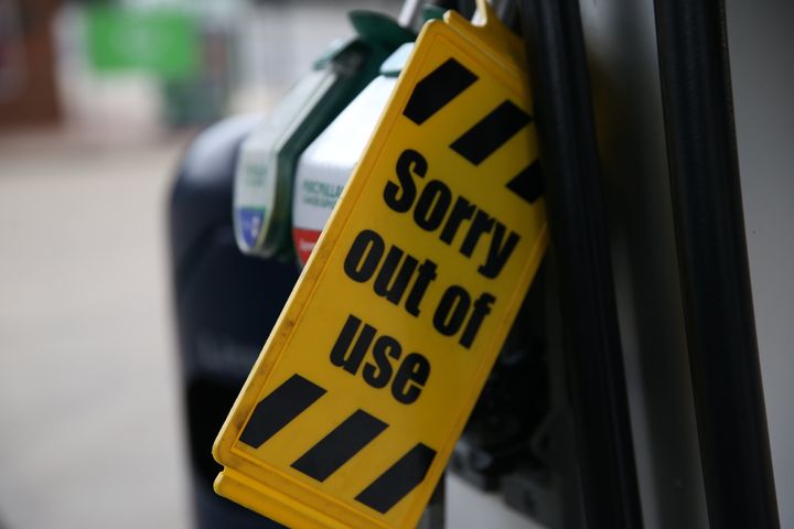 Out of use sign is attached to pumps at a petrol station in London.