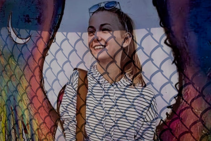 A memorial poster of Gabby Petito hangs on a fence across the street from the funeral home where her memorial service was held last weekend.