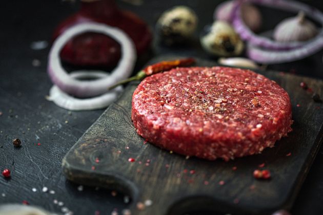 Stack of fresh raw beef burger patty