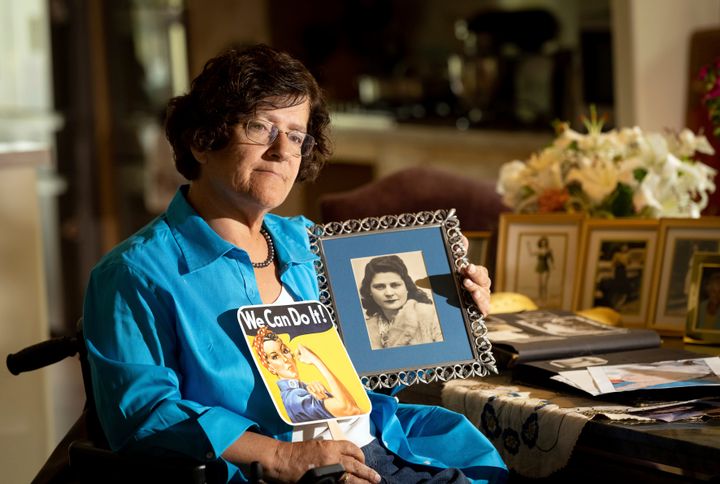 Dorene Giacopini holds up a photo of her mother, Primetta Giacopini. 