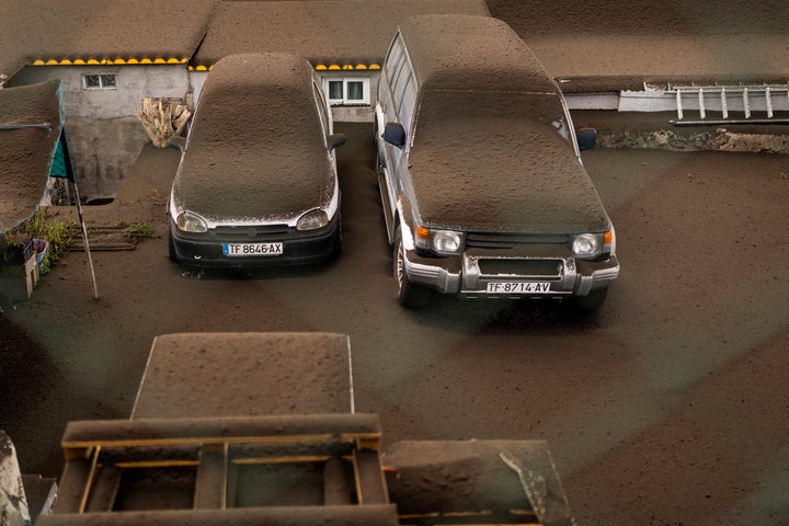 Vehicles are covered by ashes from a volcano eruption at the island of La Palma in the Canaries, Spain.