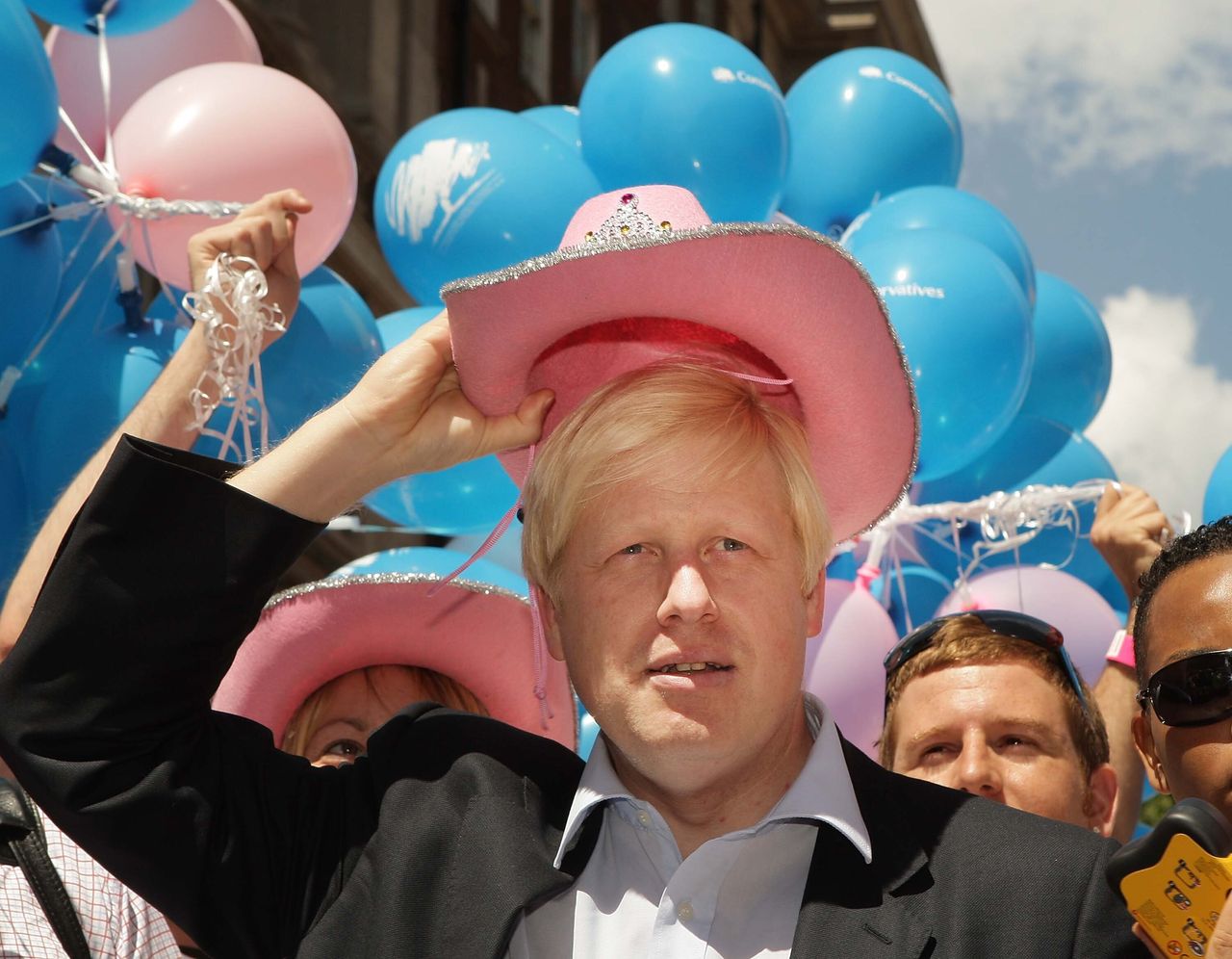 The former London Mayor Boris Johnson wears a pink stetson hat at the Gay Pride parade in 2008.