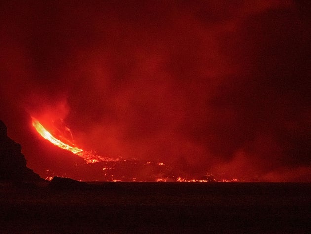 The lava flow produced by the Cumbre Vieja volcano falls into the Atlantic Ocean at Los Girres beach...