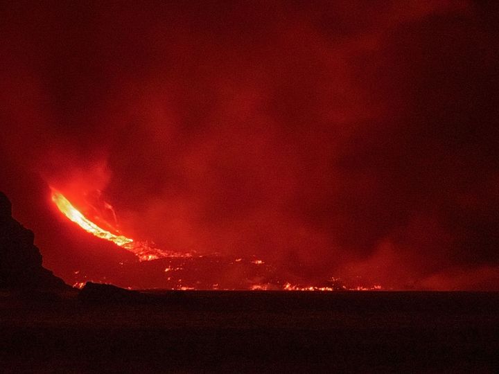 The lava flow produced by the Cumbre Vieja volcano falls into the Atlantic Ocean at Los Girres beach in Tazacorte on the Canary island of La Palma early