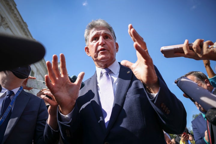 Sen. Joe Manchin (D-W.Va.) speaks to reporters outside of the U.S. Capitol.