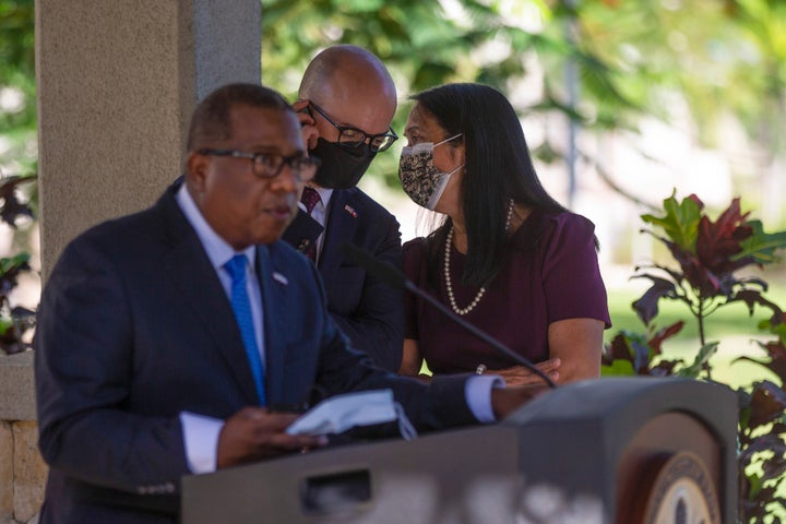U.S. Ambassador to Haiti Michele Sison, right, talks with National Security Council Senior Director for the Western Hemisphere Juan Sebastian Gonzalez, center, as Assistant Secretary for Western Hemisphere Affairs Brian Nichols speaks at the U.S. Embassy in Port-au-Prince.