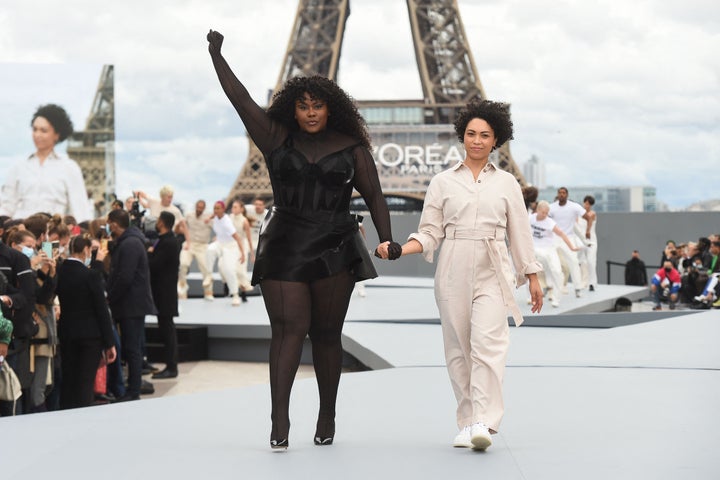 French singer/songwriter Yseult (L) presents a creation for L'Oreal on the sidelines of the Paris Fashion Week Spring-Summer 2022 Ready-to-Wear collection shows at the Trocadero, in Paris on Oct. 3.