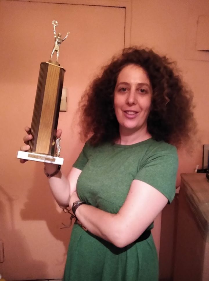 The author in September with her last remaining trophy, which her parents found when moving out of the East 23rd Street apartment.
