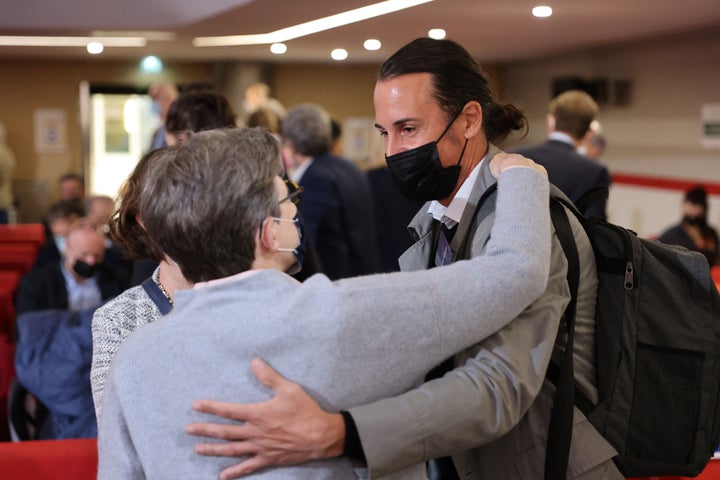 Olivier Savignac, right, one of the victims, greets an attendee during the publishing of a report by an independant commission into sexual abuse by church officials (Ciase) on Oct. 5, 2021, in Paris.