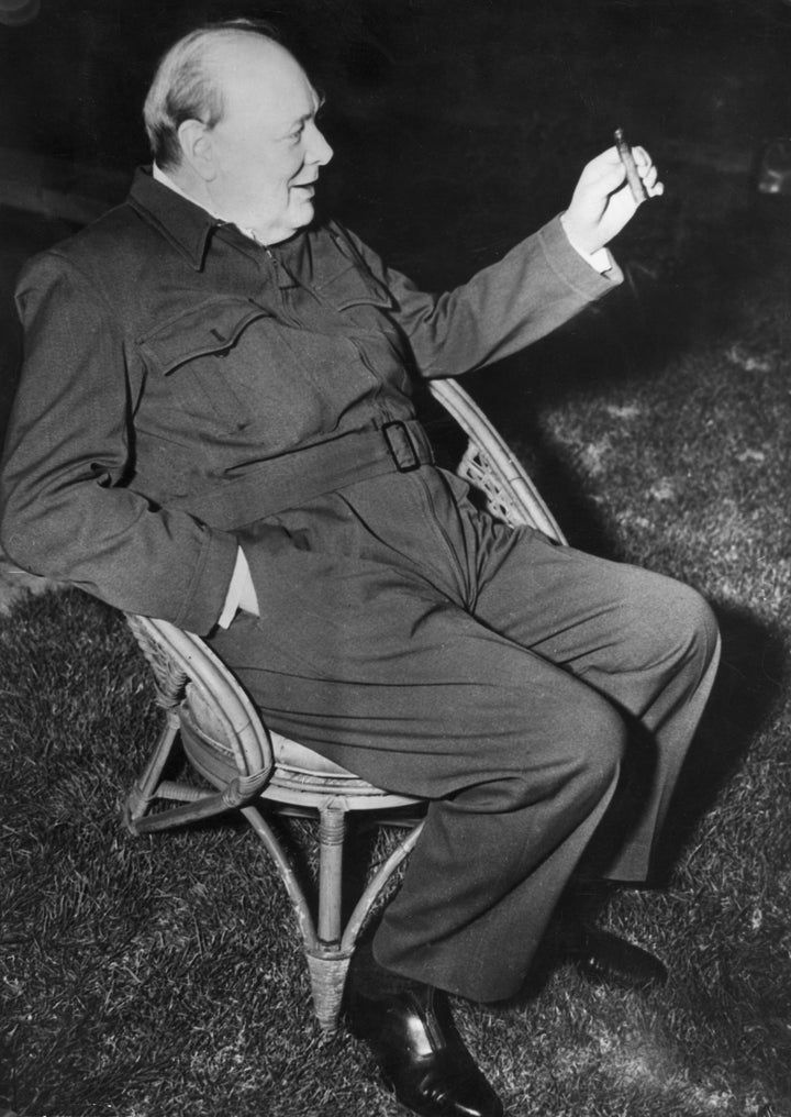 Churchill wears a siren suit as he relaxes in a garden chair during a visit to the U.S. in January 1942. 