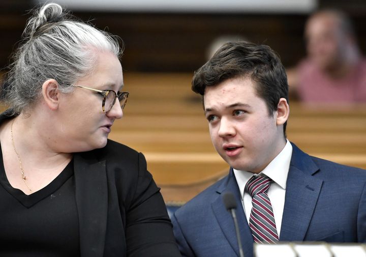 Kyle Rittenhouse, right, accused of shooting three people during a protest against police brutality in Wisconsin last year, speaks with one of his attorneys, Natalie Wisco, during a motion hearing, Tuesday, Oct. 5, 2021, in Kenosha, Wis. (Sean Krajacic/The Kenosha News via AP, Pool)