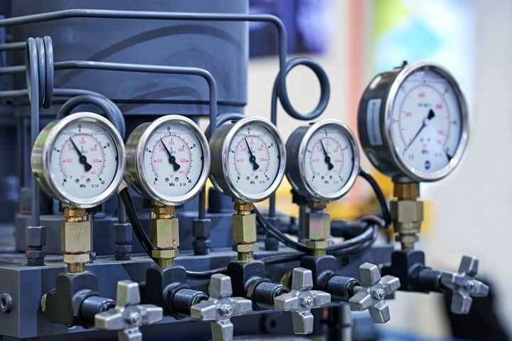 Close-up of group pressure gauges on the pipeline.