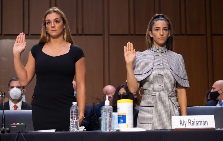 U.S. gymnasts Maggie Nichols (L) and Aly Raisman (R) are sworn in to testify during a Senate Judiciary hearing about the inspector general's report on the FBI's mishandling of the Larry Nassar investigation of sexual abuse, on Sept. 15, 2021.