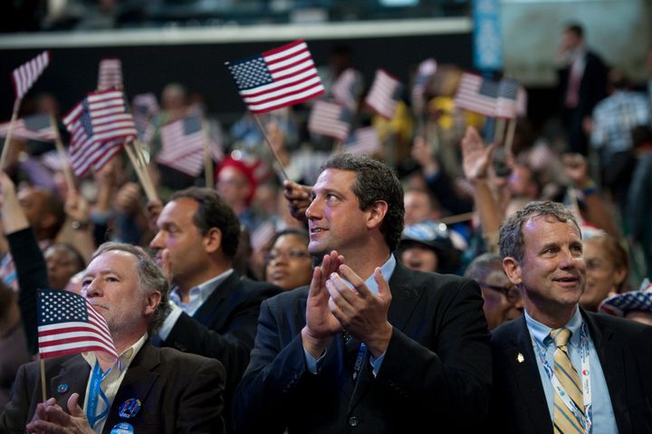 Ryan, second from right, stands next to Sen. Sherrod Brown (D-Ohio), right, at the 2012 Democratic National Convention. Brown is more progressive, but they both emphasize labor.