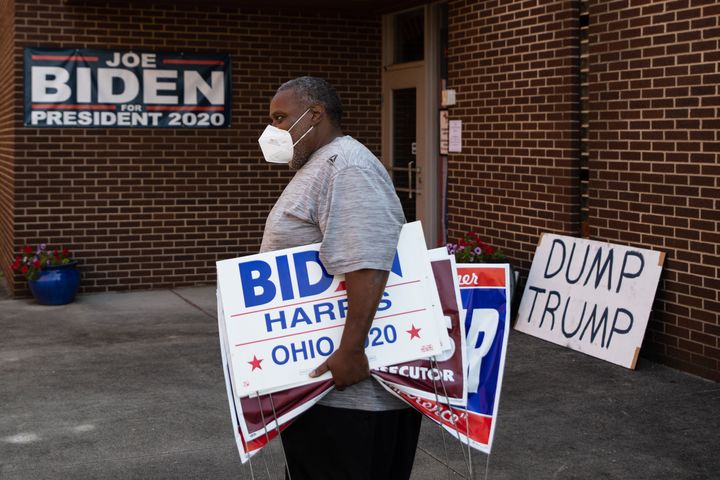 Tony Hickson holds signs in support of Joe Biden in Youngstown, Ohio, on September 22, 2020. The state has grown more elusive for Democrats in recent years.