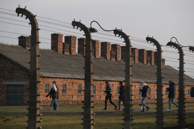 Barbed wire and prisoner barracks at the former Auschwitz-Birkenau German concentration