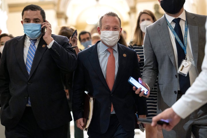 Rep. Josh Gottheimer, a conservative New Jersey Democrat, center, has led efforts to decouple the bipartisan infrastructure bill from the budget reconciliation package.