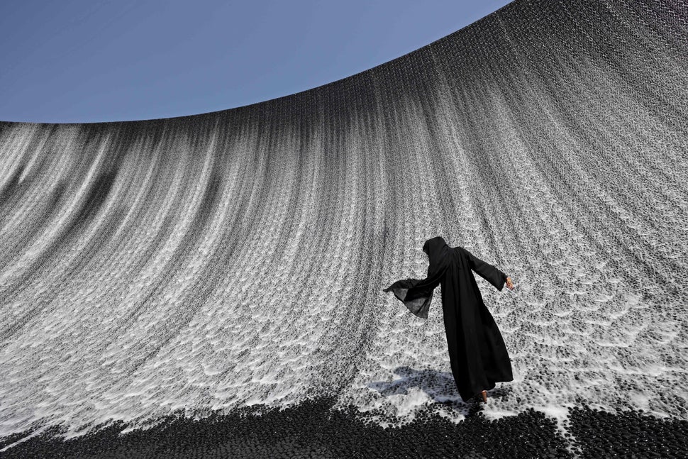 A woman walks onto the Expo Water Feature in Dubai on Oct.