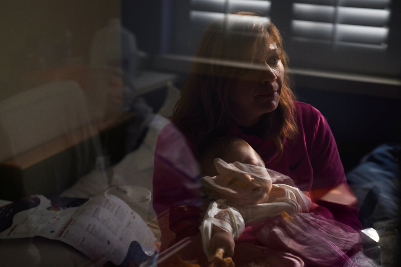 Nicole Thompson holds her son Wilder, who is being treated for the coronavirus at SSM Health Cardinal Glennon Children's Hospital in St. Louis, Missouri, on Oct. 5. 