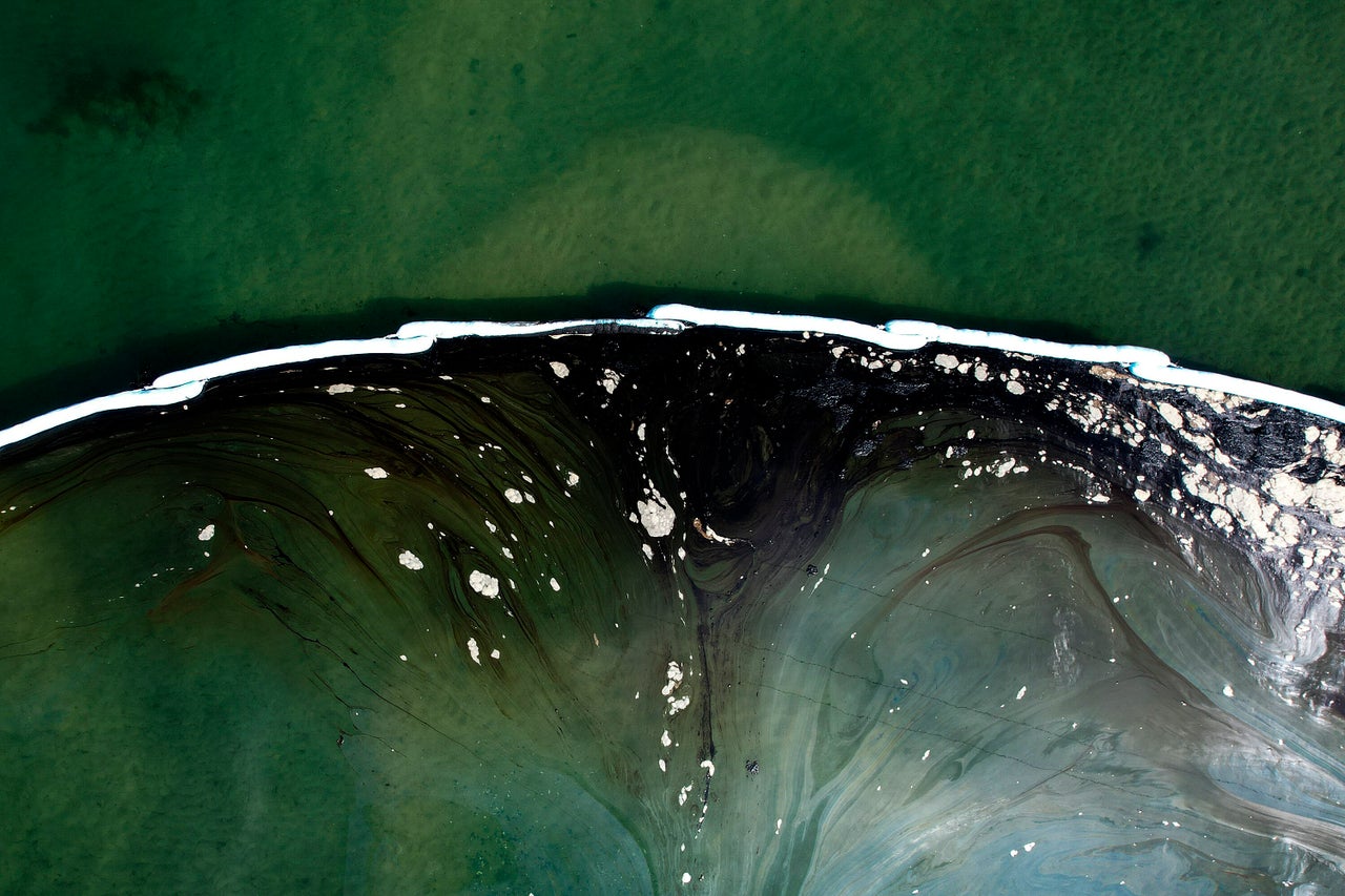 Floating barriers known as booms, pictured on Oct. 4, have been set up to try to stop further incursion into the Talbert Marsh after an oil spill in Huntington Beach, California. The major spill fouled popular beaches and killed wildlife while crews scrambled to contain the crude before it spread further into protected wetlands.