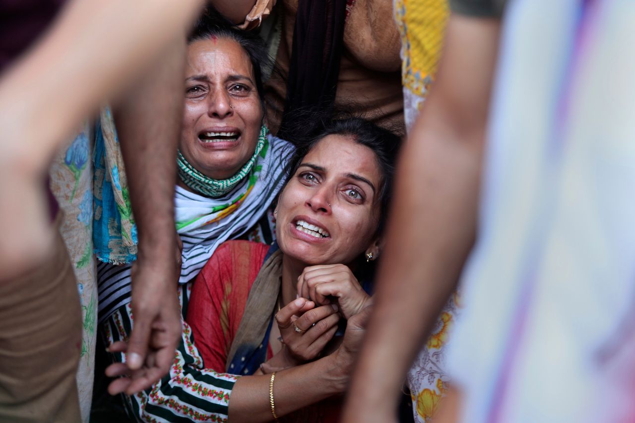 Aradhana, center, wife of Deepak Chand, a schoolteacher who was killed in Kashmir, mourns before the cremation in Jammu, India, on Oct. 8. Assailants fatally shot two schoolteachers in Indian-controlled Kashmir on Thursday in a sudden rise in targeted killings of civilians in the disputed region, police said. Authorities blamed militants fighting against Indian rule for the attack in the outskirts of Srinagar, the region’s main city.