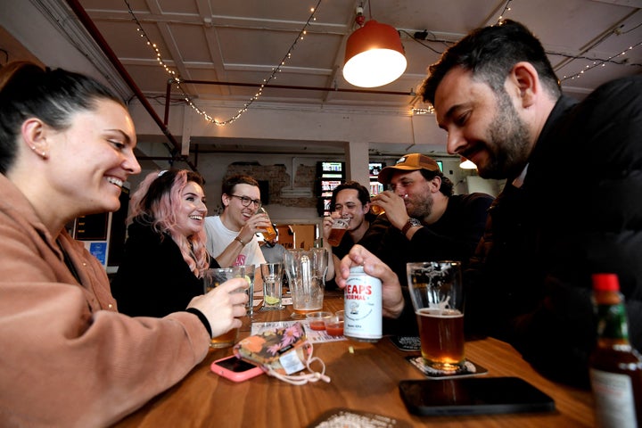 People enjoy their drinks at a pub on Oct.11, 2021, as Sydney ended their lockdown after 106 days and restaurants began throwing open their doors to anyone who could prove they were vaccinated.