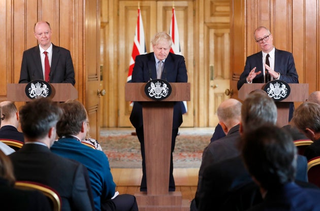 Prime minister Boris Johnson flanked by the UK's chief medical adviser Chris Whitty (left) and the chief...