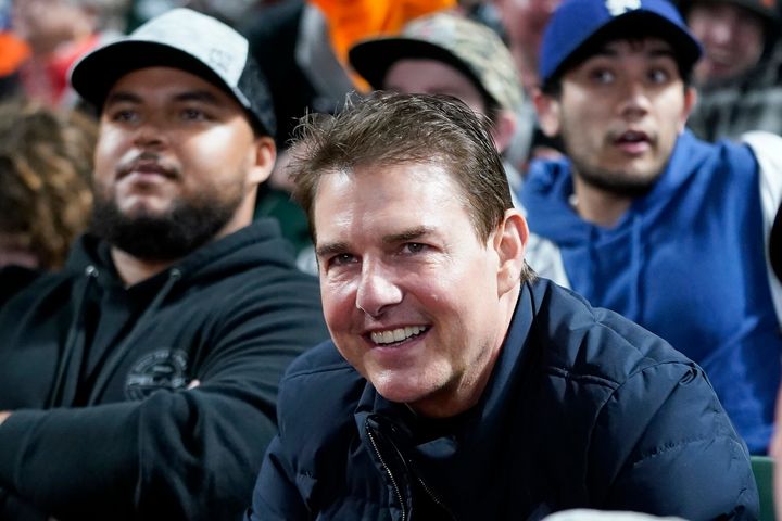 Actor Tom Cruise smiles during Game 2 of a baseball National League Division Series between the San Francisco Giants and the Los Angeles Dodgers Saturday, Oct. 9, 2021, in San Francisco. (AP Photo/Jeff Chiu)