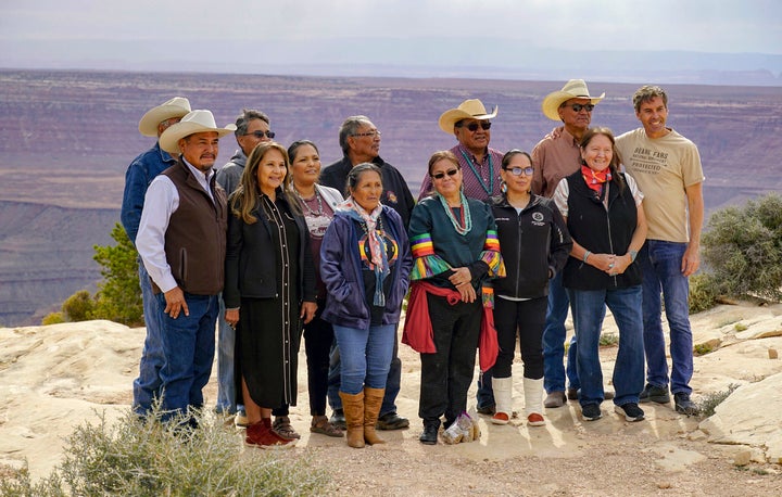 Board members, staff and supporters of the Indigenous-led group Utah Diné Bikéyah celebrate President Joe Biden's decision to restore the boundaries of Bears Ears National Monument at an overlook on Cedar Mesa in San Juan County on Oct. 8, 2021, in Utah.