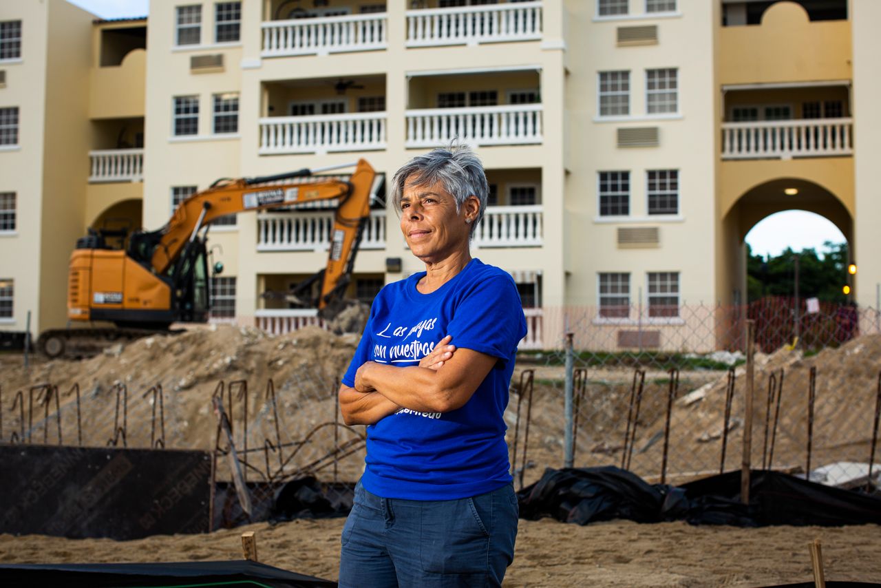 Miriam Juan Rivera, a community leader, stands in front of the Playa y Sol complex at Los Almendros beach on Aug. 2. She was one of the first to join an encampment on the beach to protest the reconstruction of the complex's pool in a nesting area for endangered turtles.