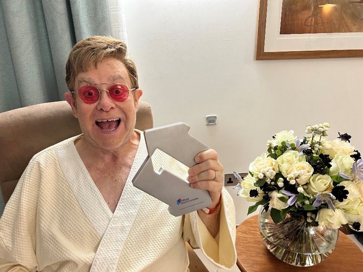 Elton John celebrating his latest number one single