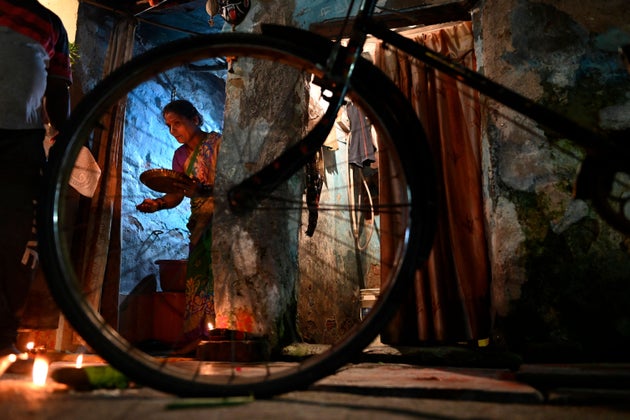 Hindu devotees perform the ritual worship Ayudha Puja on their bicycles on the occasion of the Dussehra-Vijay...