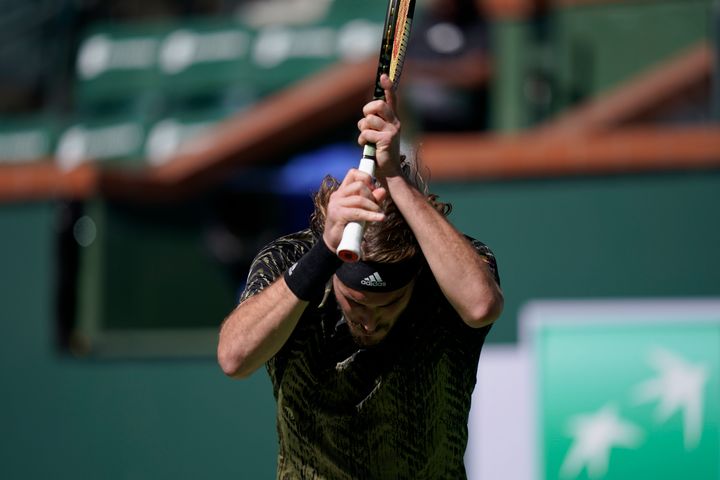 Stefanos Tsitsipas, of Greece, reacts to losing a point to Nikoloz Basilashvili, of Georgia, at the BNP Paribas Open tennis tournament Friday, Oct. 15, 2021, in Indian Wells, Calif. (AP Photo/Mark J. Terrill)