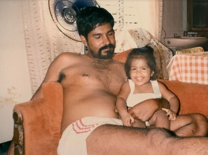 The author, age 10 months, with her father.