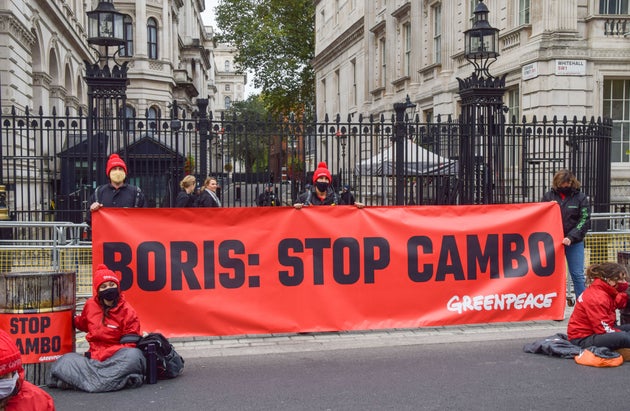 Activists hold a 'Boris: Stop Cambo' banner during the Stop Cambo