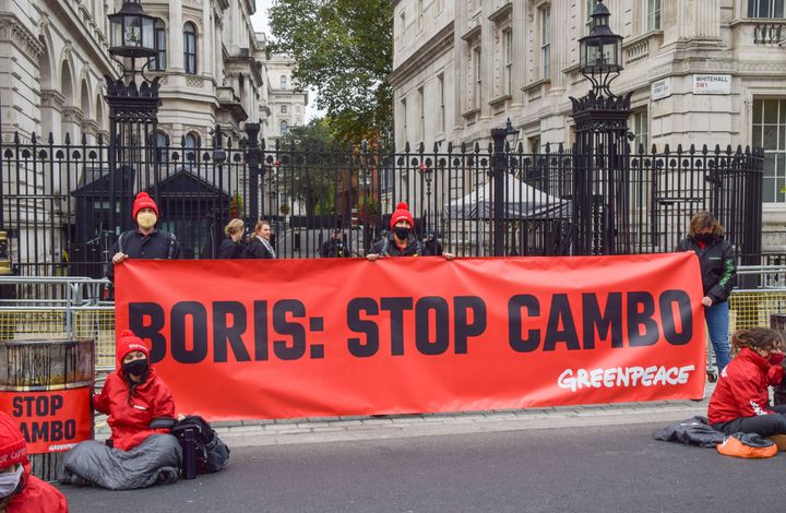 Activists hold a 'Boris: Stop Cambo' banner during the Stop Cambo protest
