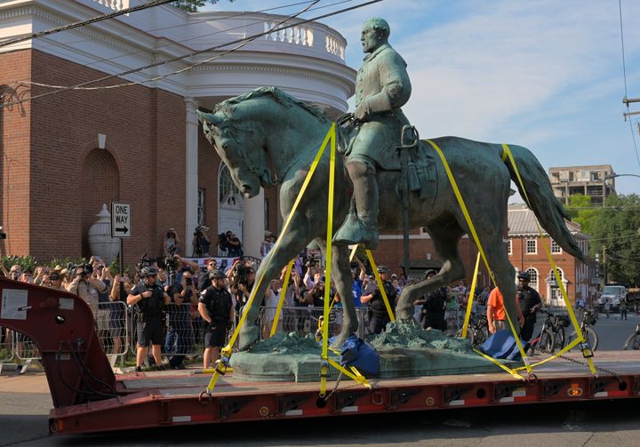 A statue of Confederate Gen. Robert E Lee located in Charlottesville, Virginia, is transported away after being removed from Market Street Park in July.