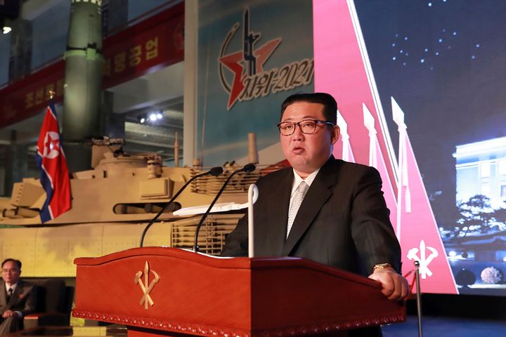 In this Oct. 11, 2021, photo provided by the North Korean government, North Korean leader Kim Jong Un speaks during an exhibition of weapons systems in Pyongyang.